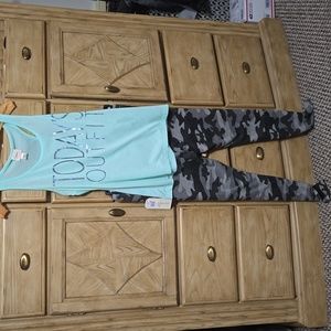 Nwt ladies 2 pc set camo leggings and tank.  Xlg top  and 1x bottoms